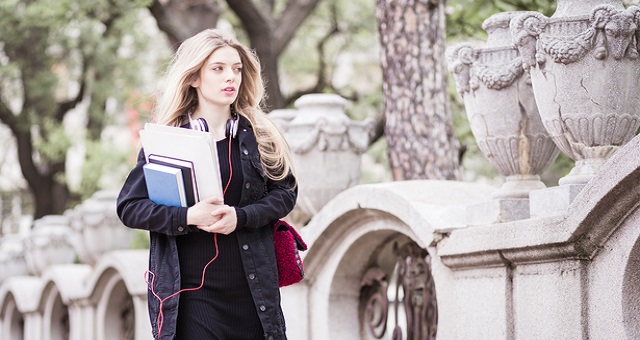 student safety, campus safety, student walking alone with headphones