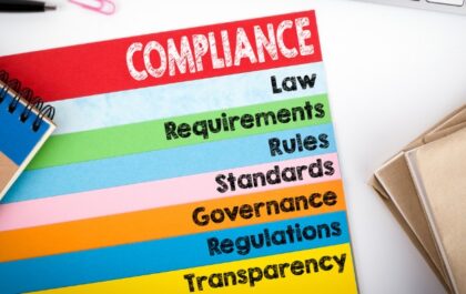 Compliance regulations on a piece of colored paper