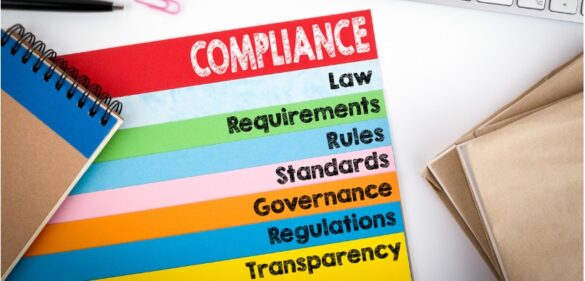 Compliance regulations on a piece of colored paper