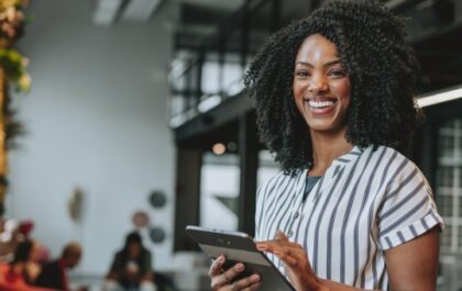 Business woman holding a laptop