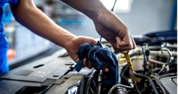 Mechanic hands working on car engine
