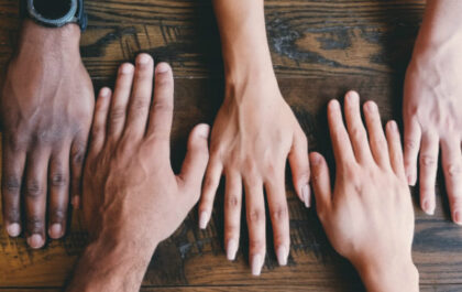 Group of hands laid out together representing different diversities