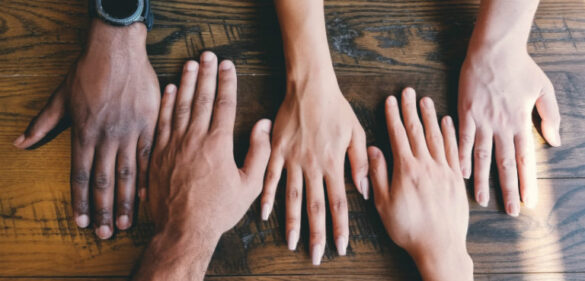 Group of hands laid out together representing different diversities