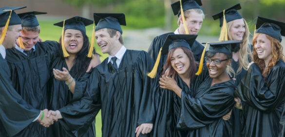 group-of-college-students-in-caps-and-gowns-laughing-having-fun