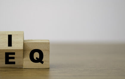 Flipping of EQ to IQ which print screen on wooden cube block. Smart idea and smart emotion concept.