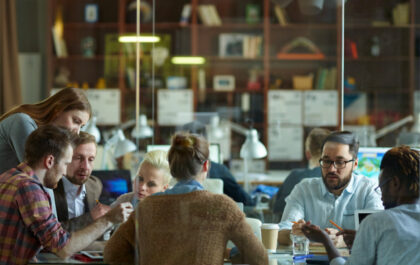 Big team discussing business plans at meeting