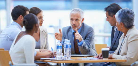 A cropped shot of a businessman sharing an idea with colleagues at a meeting