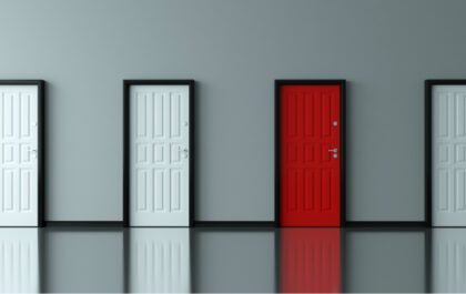 multiple doors-against-wall-three-white-doors-one-red